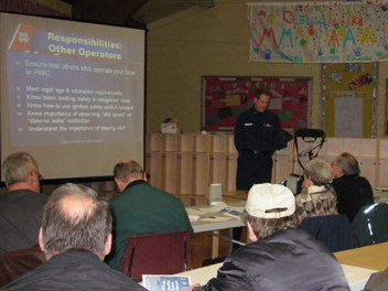 Flotilla commander presents information during boating safety class